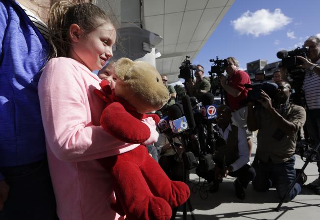 Girl Gets Back Teddy Bear Lost in Airport Shooting