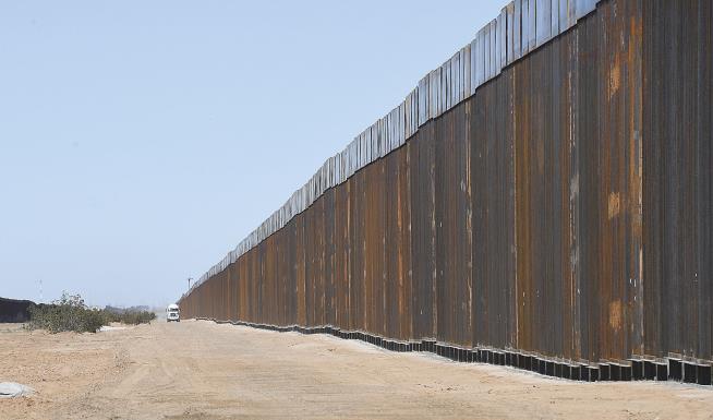 Trump Wants Border Wall Painted Black. That'll Be Pricey