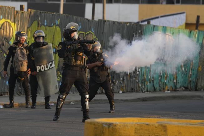 In Peru, 'Deactivators' Run Toward Tear Gas