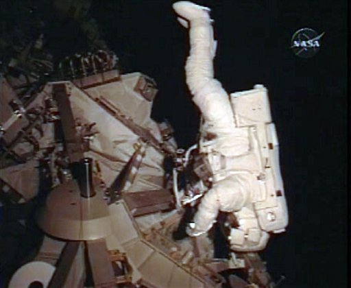Astronauts Wipe Off Grime on Final Walk