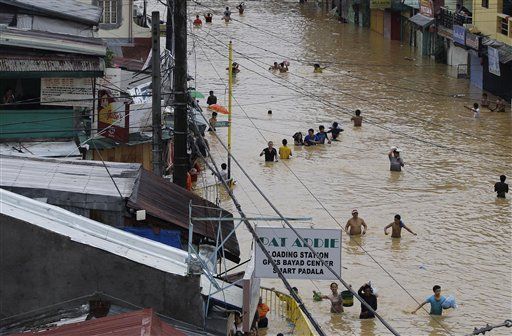 People Still Stuck on Roofs in Flooded Manila