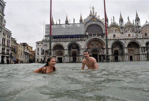 Tourists Swim in Flooded Venice Square