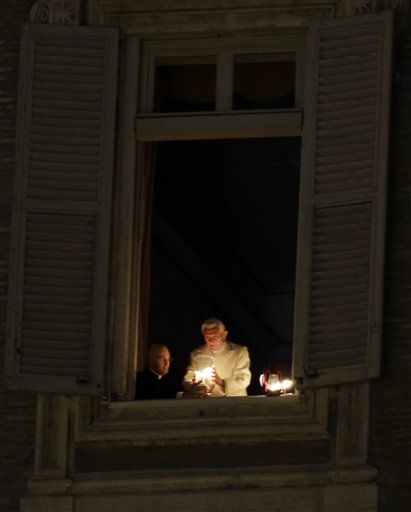 Pope Lights Christmas Candle