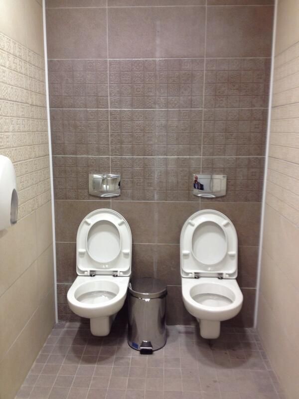 In One Sochi Men's Bathroom Stall, 2 Toilets