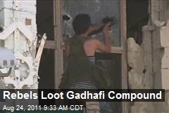 Rebels Loot Gadhafi Compound