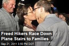 Freed Hikers Race Down Plane Stairs to Families