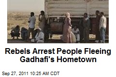 Rebels Arrest People Fleeing Gadhafi&#39;s Hometown