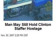 Man May Still Hold Clinton Staffer Hostage