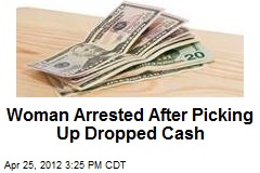 Woman Arrested After Picking Up Dropped Cash
