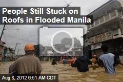 People Still Stuck on Roofs in Flooded Manila