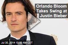 Orlando Bloom Takes Swing at Justin Bieber