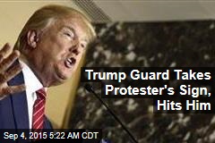 Trump Guard Takes Protester&#39;s Sign, Hits Him
