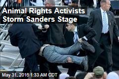 Animal Rights Activists Storm Sanders Stage