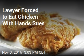 Lawyer Forced to Eat Chicken With Hands Sues
