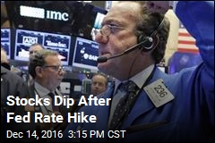 Stocks Dip After Fed Rate Hike