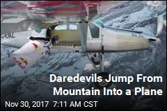 Daredevils Jump From Mountain Into a Plane