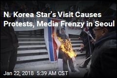 Protesters Burn Kim&#39;s Photo as N. Korea Star Visits Seoul