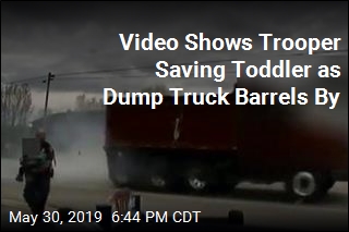 Video Shows Trooper Saving Toddler as Dump Truck Barrels By
