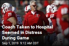 After Clutching Chest, Coach Leaves Game in an Ambulance