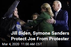 Biden Protected From Protester by His Wife, Female Adviser