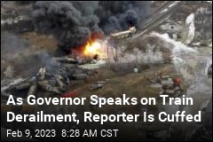 As Governor Speaks on Train Derailment, Reporter Is Cuffed