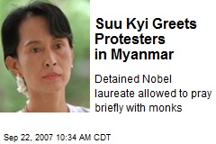 Suu Kyi Greets Protesters in Myanmar