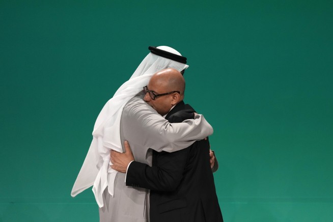 In a first, delegates at UN climate talks agree to transition away from planet-warming fossil fuels