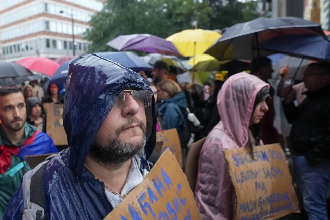 Protesters encircle Serbian state TV building to press government to ease its grip on media