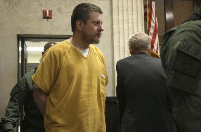 The Latest: Van Dyke barely reacts to prison sentence