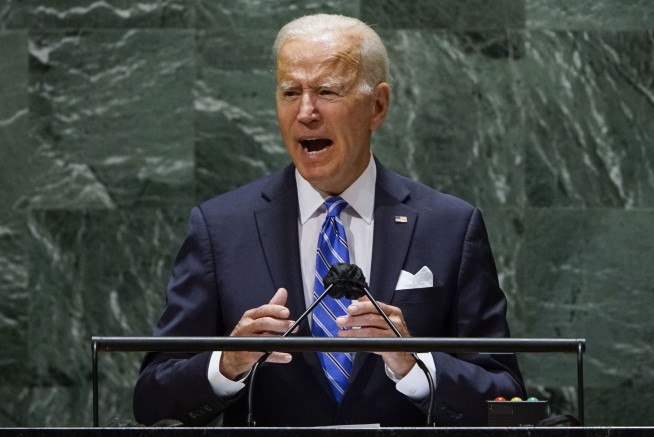 Biden doubling vaccine purchase, calls for more global shots
