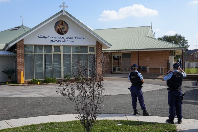 Teenager is charged with terrorism offenses in stabbings of bishop and priest at Sydney church