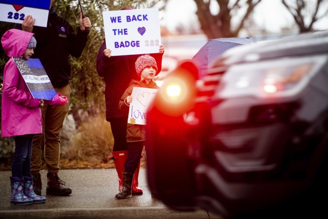 Slain police officer called 'American hero' at his funeral