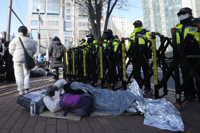 South Korea's impeached president is arrested over a martial law declaration as his supporters riot