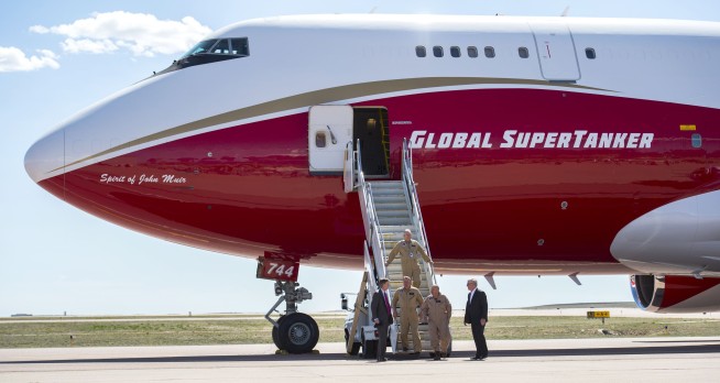 New wildfires sweep through California, burning homes