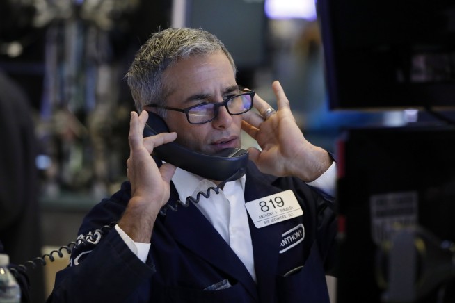 Stocks stumble on trade-war worries, capping wild week