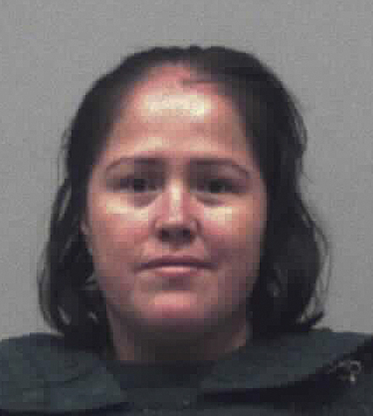 Mother charged with killing 4 of her kids and their father