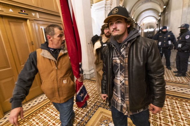 Confederate flag-toting man, son convicted in Capitol riot