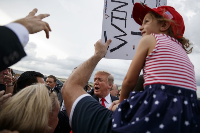 Promoting voter ID, Trump says ID needed to buy groceries