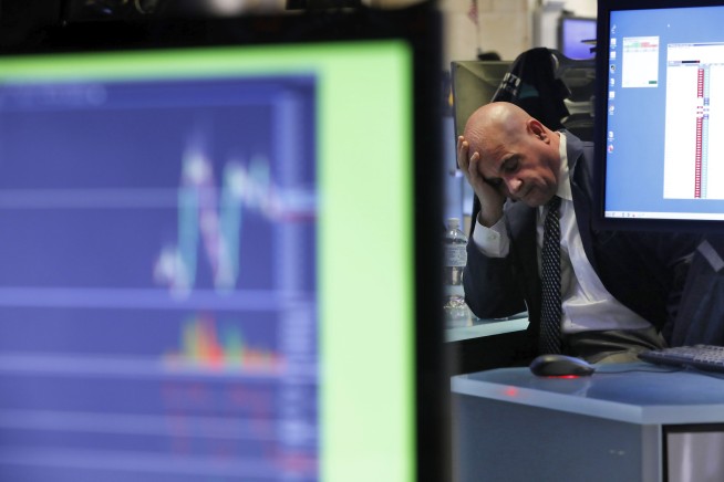 Stocks sink, bonds soar on fears virus will stunt economy