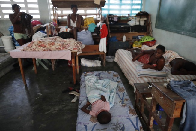 Haitians rebuild lives as food, water, supplies arrive