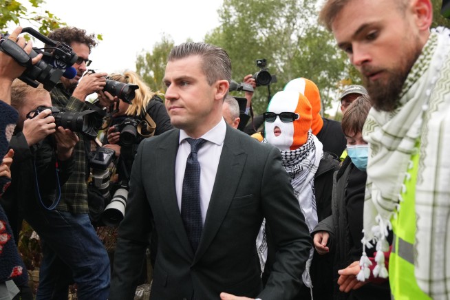 A British court throws out a terror-related charge against a member of the Irish rap group Kneecap