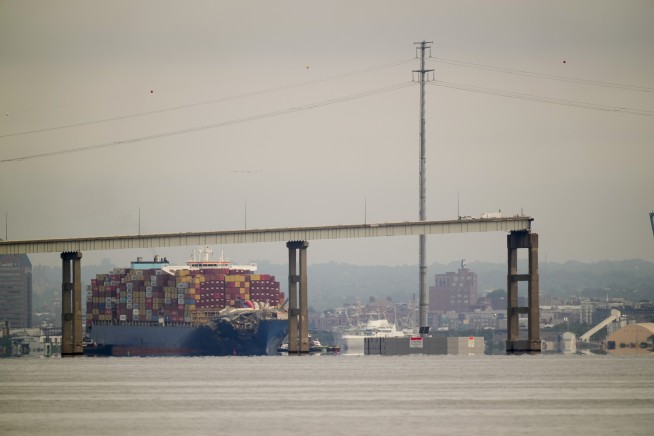 Tugboats escort ship that caused deadly Baltimore bridge collapse back to port