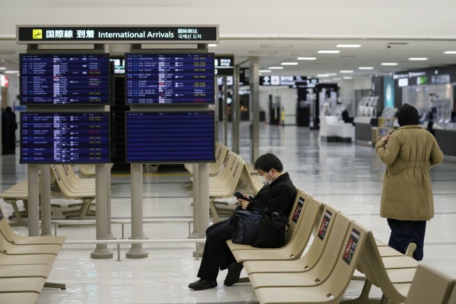 Japan retracts new flight bookings ban after criticisms