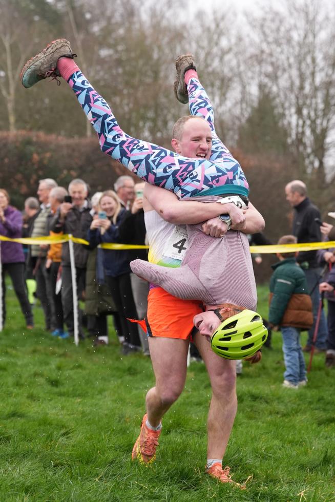 Finnish pair wins a barrel of ale in annual 'wife-carrying' contest in England