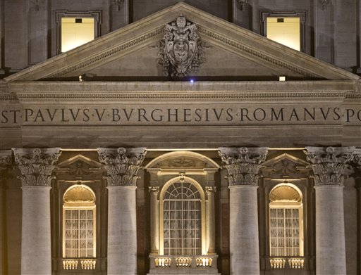 Protester takes perch on St. Peter's façade