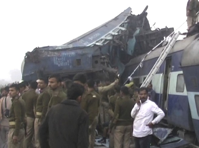 Train derails in north India, killing 104; many trapped
