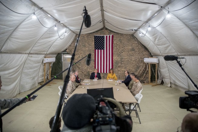 The Latest: Trump visits US troops in Iraq without Mattis
