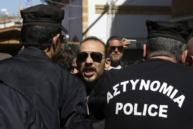 Cyprus police pepper spray protesters at shut crossing point