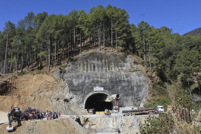 Indian rescuers start drilling to reach 40 workers trapped in a collapsed tunnel since the weekend