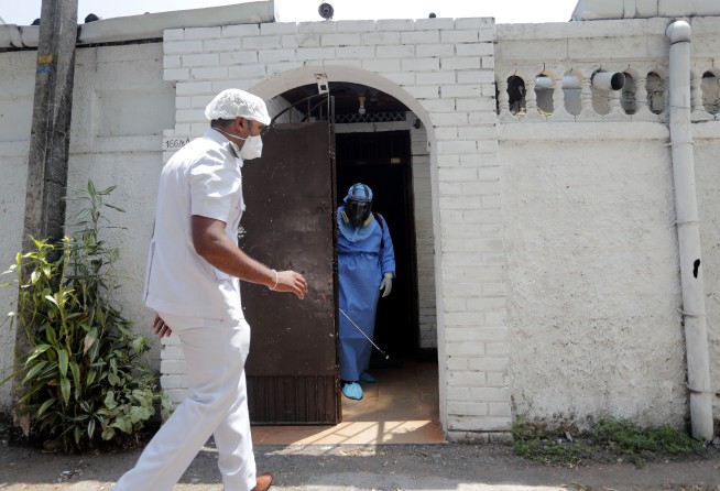 The Latest: Pentagon restricts access to building over virus